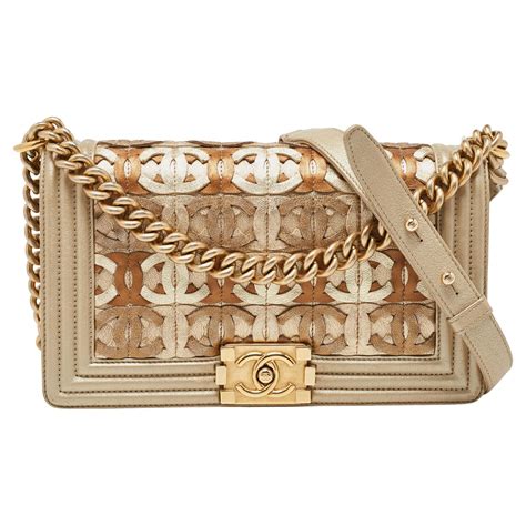 chanel bag beige gold cc cutout leather medium boy flap